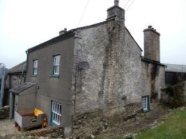 The suitability of the remaining plaster at a National Trust Farm, at Levens, to carry softwood fibreboard insulation and suggested insulated wall build-ups for this building